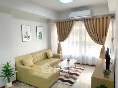 Bright living room with modern beige sofa and elegant decor