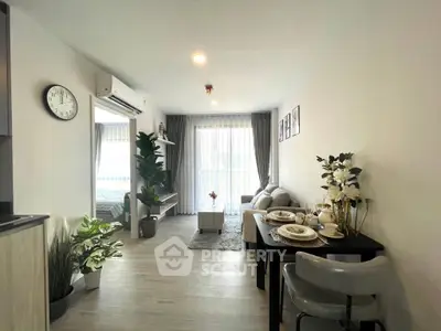 Modern living room with dining area, stylish decor, and natural light in a contemporary apartment.