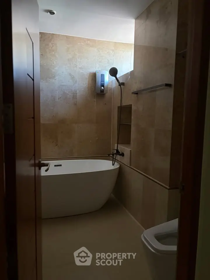 Luxurious bathroom with modern bathtub and elegant tile design