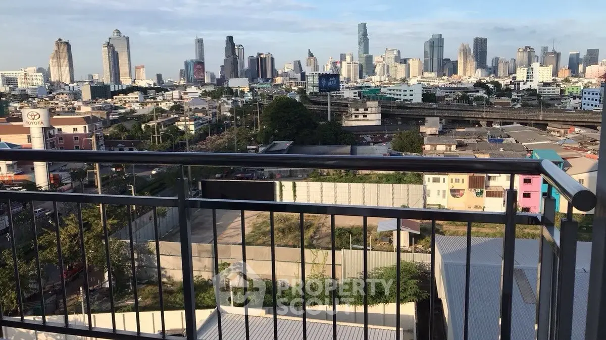 Stunning city skyline view from a high-rise balcony, perfect for urban living.