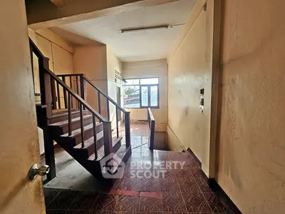 Spacious stairway with natural light in a residential building