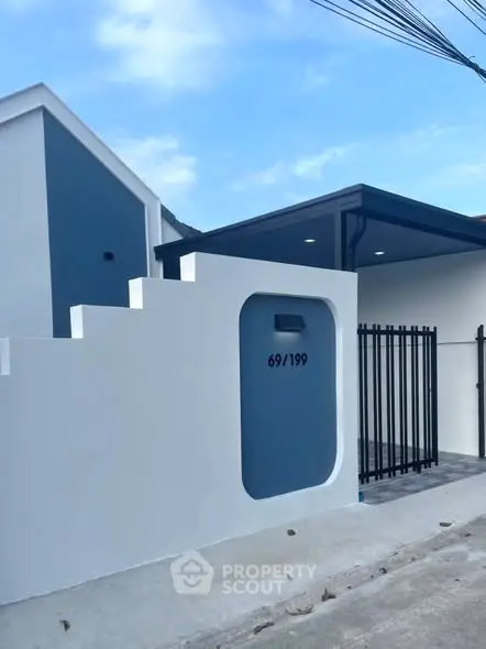 Modern minimalist exterior with sleek design and unique architectural features.