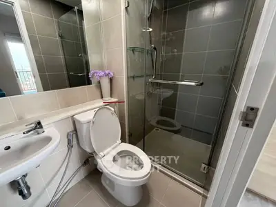 Modern bathroom with glass shower and sleek fixtures