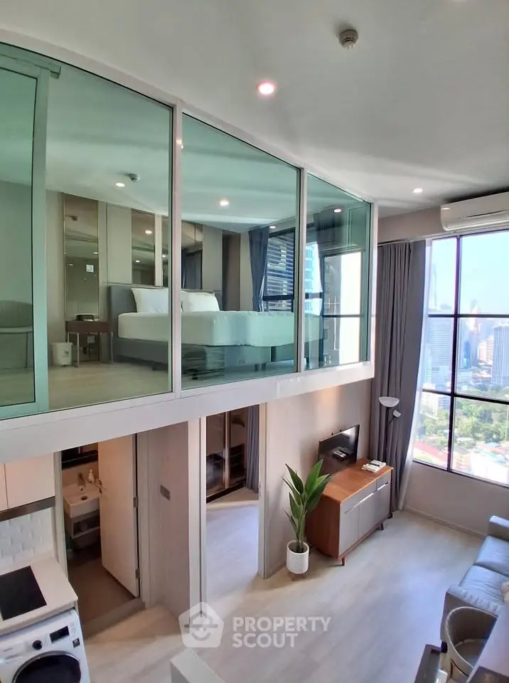 Modern loft apartment with mezzanine bedroom and city view, featuring open layout and stylish decor.