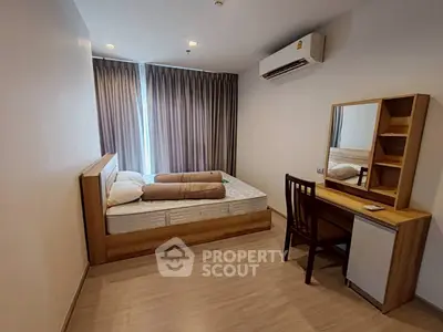 Modern bedroom with wooden furniture and air conditioning in a cozy apartment.