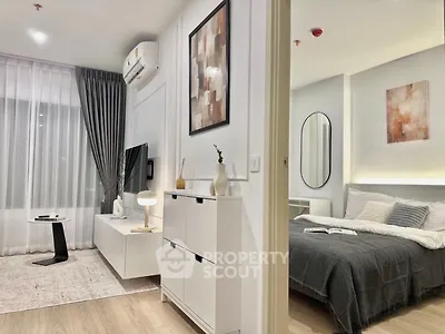 Modern studio apartment with stylish living area and cozy bedroom