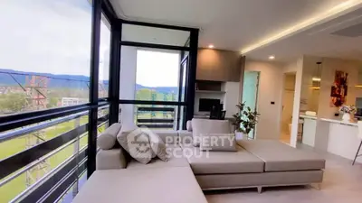 Spacious living room with panoramic windows and modern decor