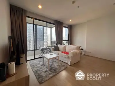 Modern living room with balcony view in high-rise apartment