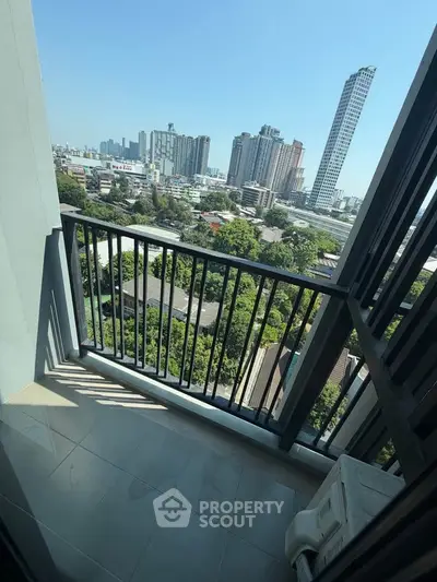 Stunning city view from a modern high-rise balcony, perfect for urban living.