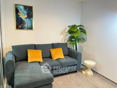 Modern living room with stylish sofa and vibrant decor accents