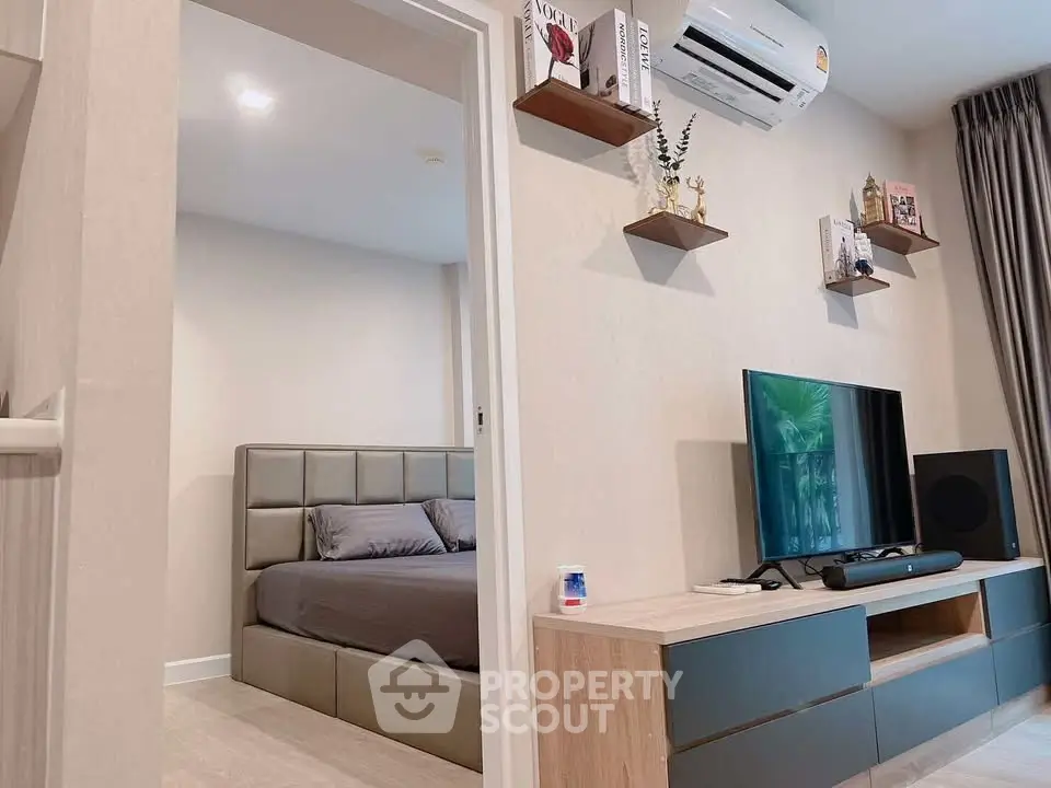Modern apartment interior with stylish living room and cozy bedroom, featuring sleek furniture and decor.
