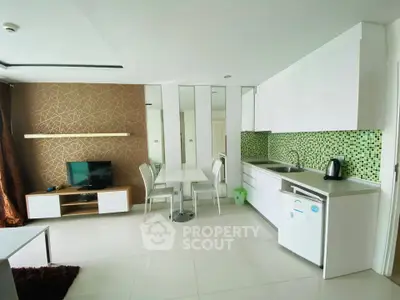 Modern open-layout kitchen with stylish backsplash and dining area