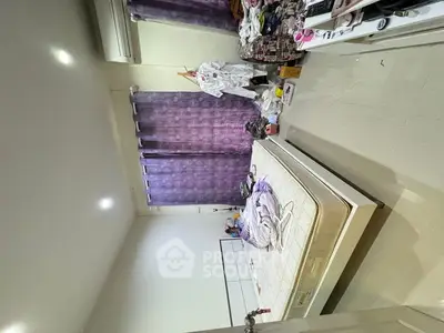 Spacious bedroom with modern design and ample natural light