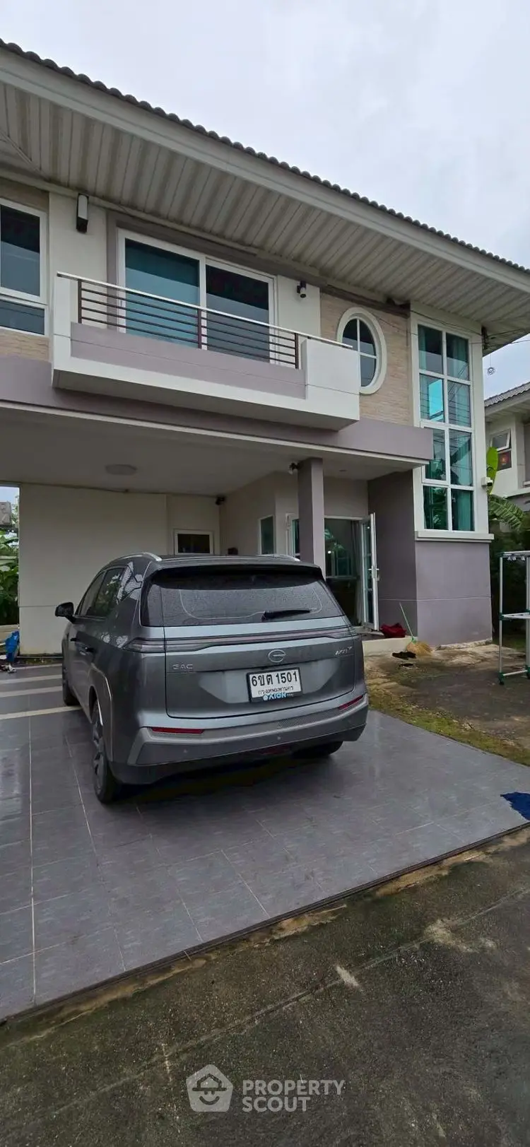 Modern two-story house with sleek design and spacious driveway