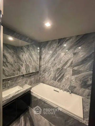 Luxurious marble bathroom with elegant bathtub and modern fixtures