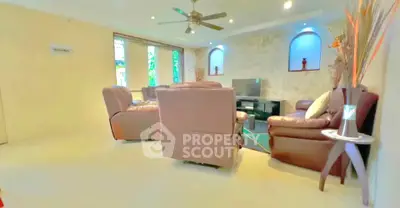 Spacious living room with modern decor and comfortable seating