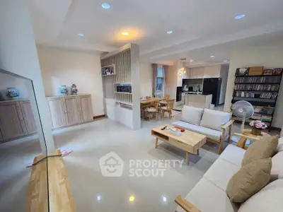 Spacious open-plan living room with modern kitchen and dining area