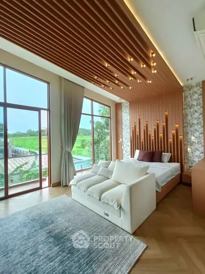 Luxurious bedroom with floor-to-ceiling windows and modern design elements.