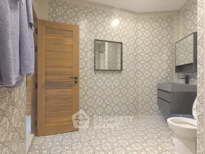Stylish bathroom with patterned tiles and modern fixtures