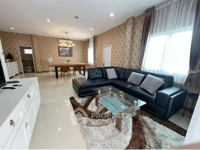 Spacious living room with elegant decor and large sectional sofa