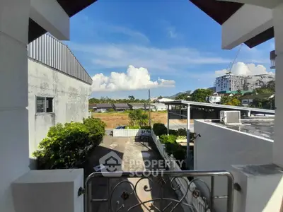 Stunning balcony view with clear skies and modern architecture, perfect for urban living.