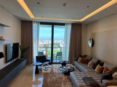 Luxurious living room with modern decor and stunning city view from large windows.