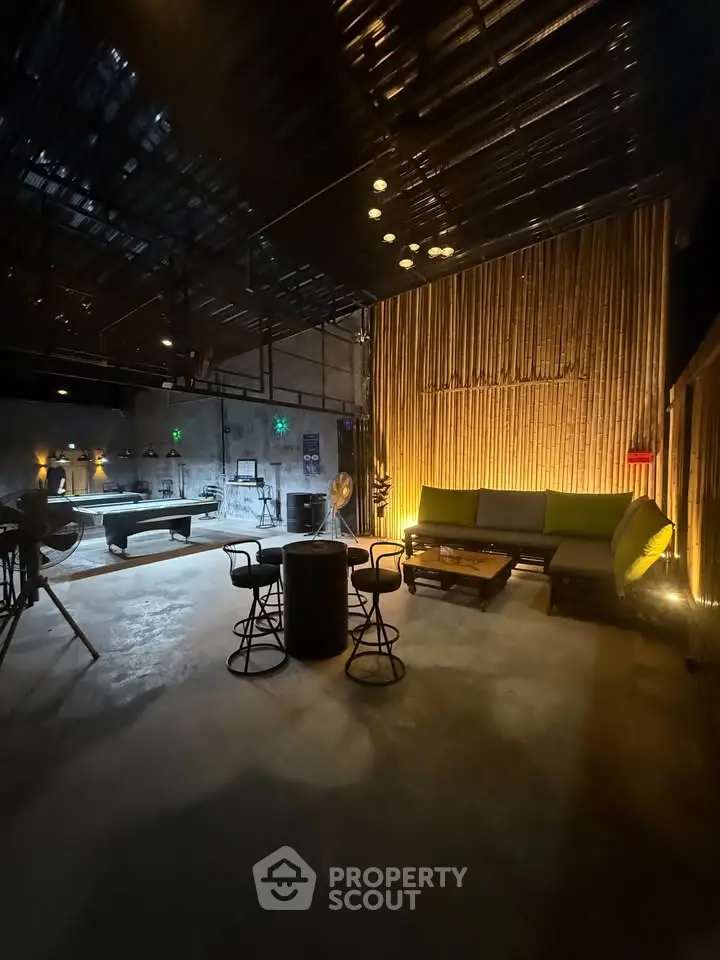 Stylish industrial living room with modern furniture and ambient lighting
