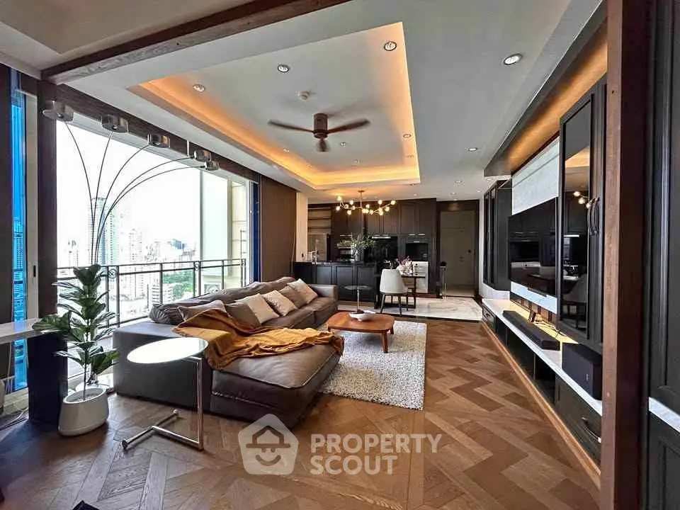Luxurious modern living room with open layout and city view, featuring elegant decor and cozy seating area.