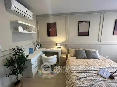 Stylish bedroom with modern decor and cozy ambiance, featuring a comfortable bed and chic workspace.