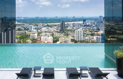 Luxurious rooftop infinity pool with stunning city skyline view, perfect for urban living.