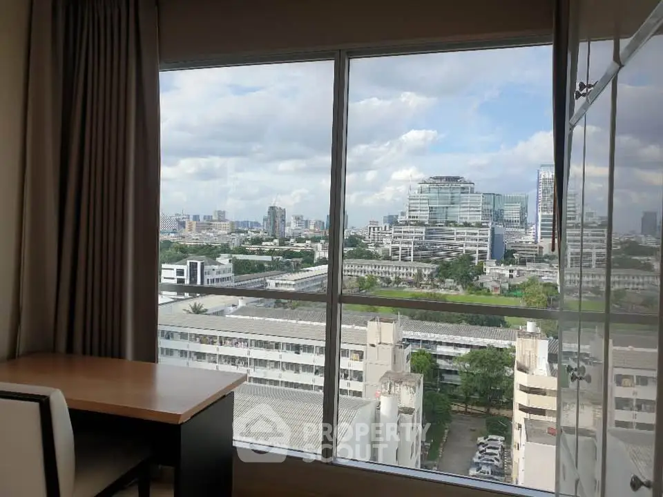 Spacious room with stunning city view from large window