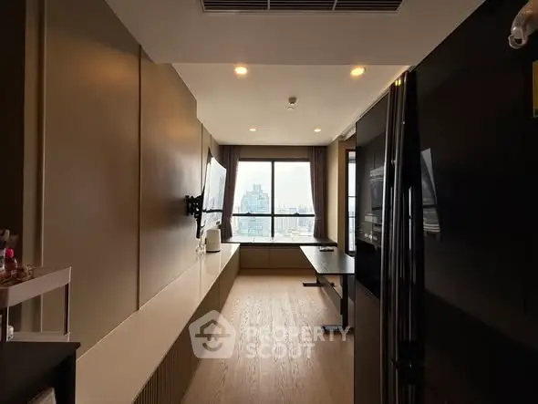 Modern apartment interior with city view, featuring sleek design and ample natural light.