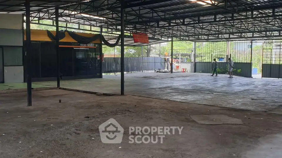 Spacious industrial warehouse with open layout and metal roofing