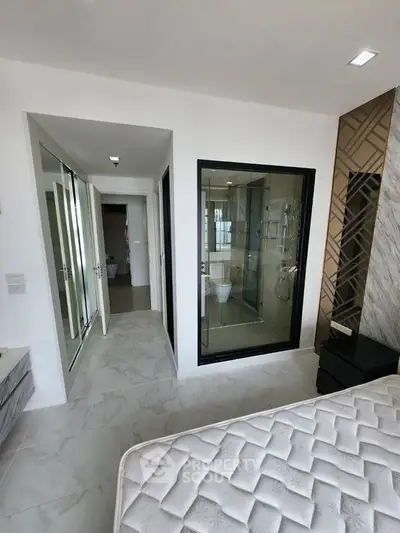 Modern bedroom with ensuite bathroom and stylish decor