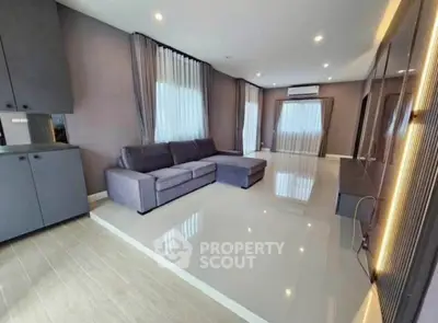 Spacious modern living room with sleek design and ample natural light