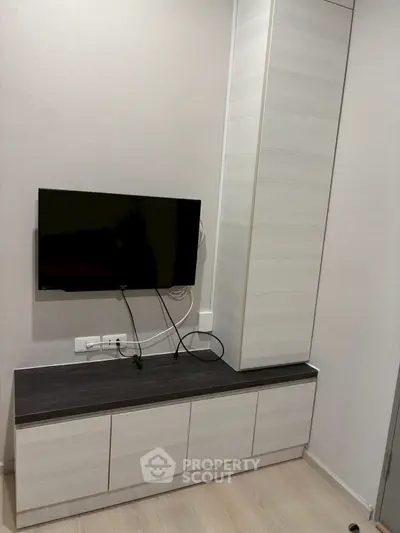 Modern living room with sleek TV unit and minimalist design