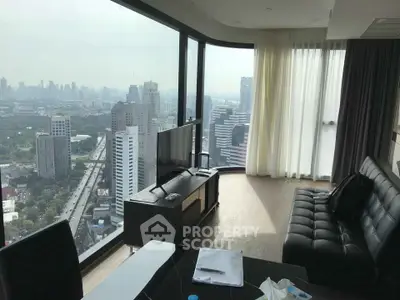 Luxurious high-rise living room with panoramic city views and modern furnishings.