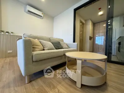 Modern living room with cozy sofa and stylish coffee table in a contemporary apartment.