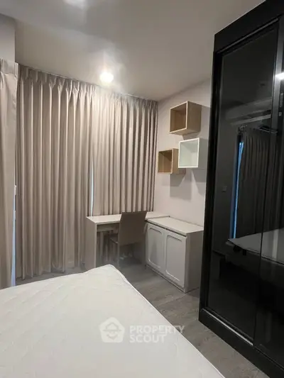 Modern bedroom with study area and stylish storage solutions