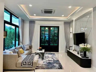 Luxurious modern living room with elegant decor and large windows