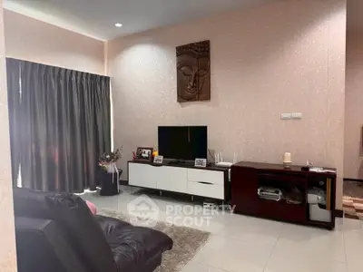 Cozy living room with modern decor and entertainment center