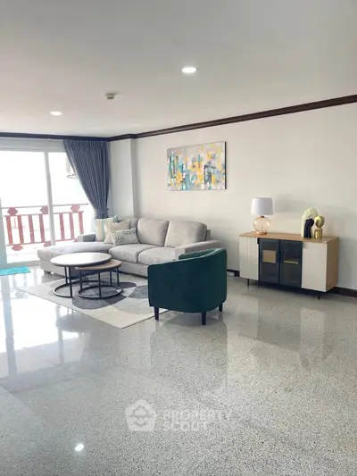 Spacious modern living room with elegant decor and large windows