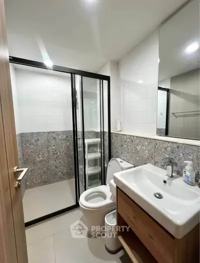 Modern bathroom with sleek design and glass shower enclosure