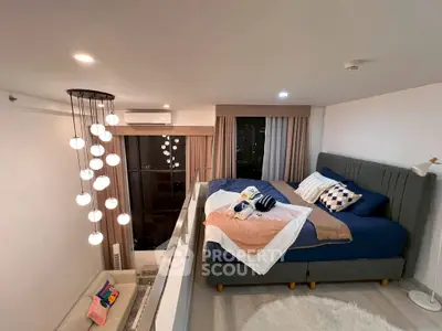 Modern loft bedroom with stylish lighting and cozy decor