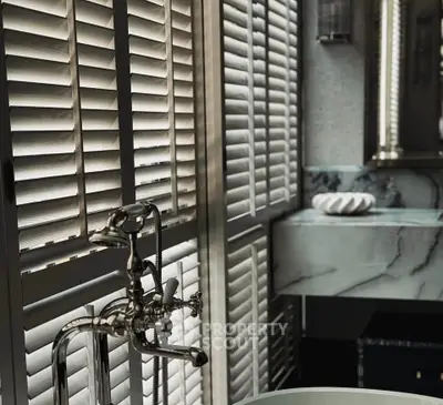 Luxurious bathroom with elegant fixtures and marble accents
