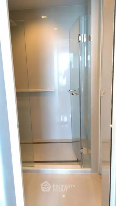 Modern bathroom with glass shower enclosure and sleek design