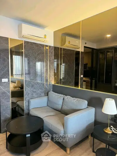 Modern living room with stylish decor and cozy seating in a contemporary apartment.