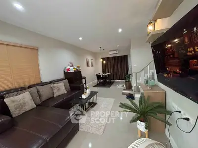 Spacious modern living room with sleek leather sofa and elegant decor