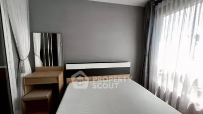 Modern bedroom with stylish decor and natural light