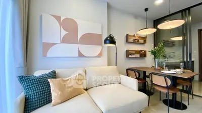 Stylish modern living room with cozy sofa and elegant dining area